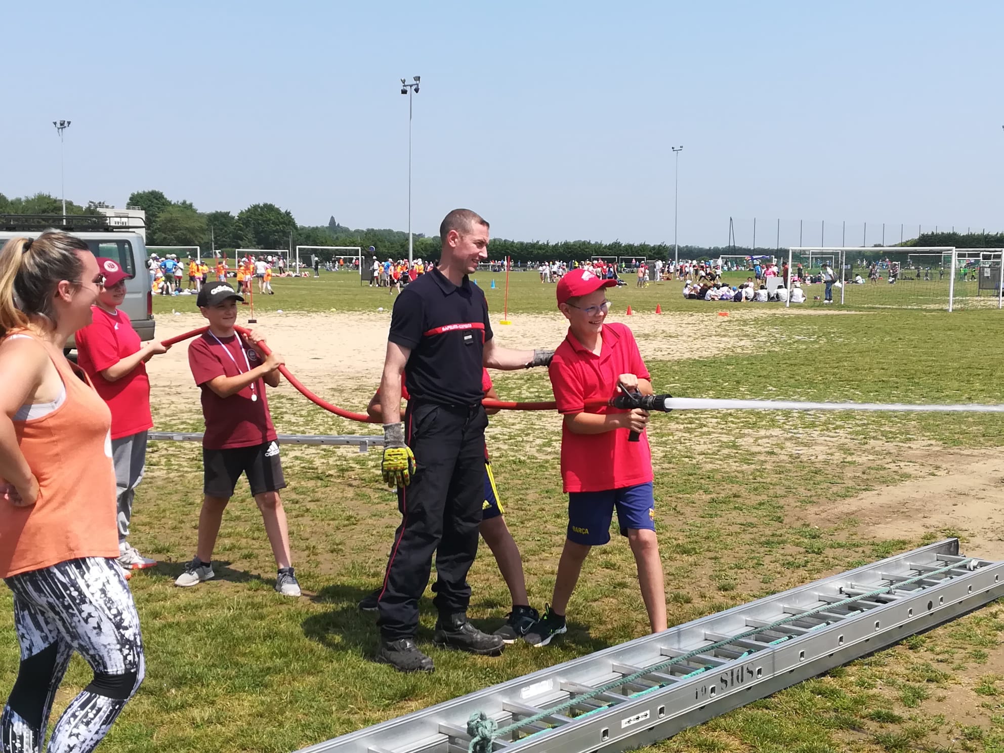 Jeux Olympiques ornais, test de la lance à incendie (Argentan, 13 juin 2023)